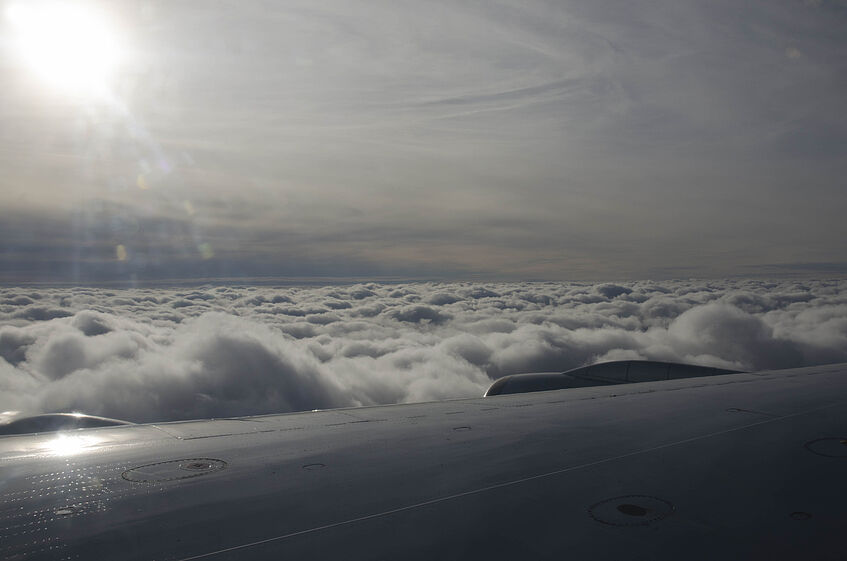 Cruising along an ocean of clouds.